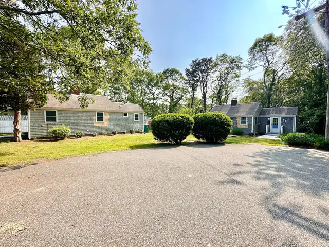 The Twin Cottages: both cottages on the corner lot, with the driveway